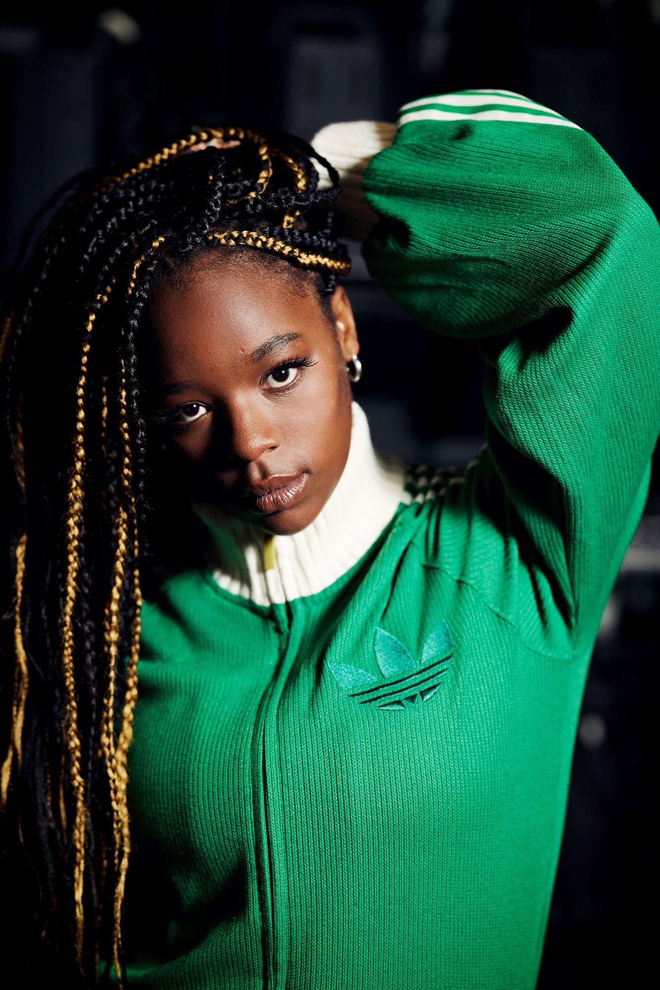 Corrina wearing a green jumper in front of the camera