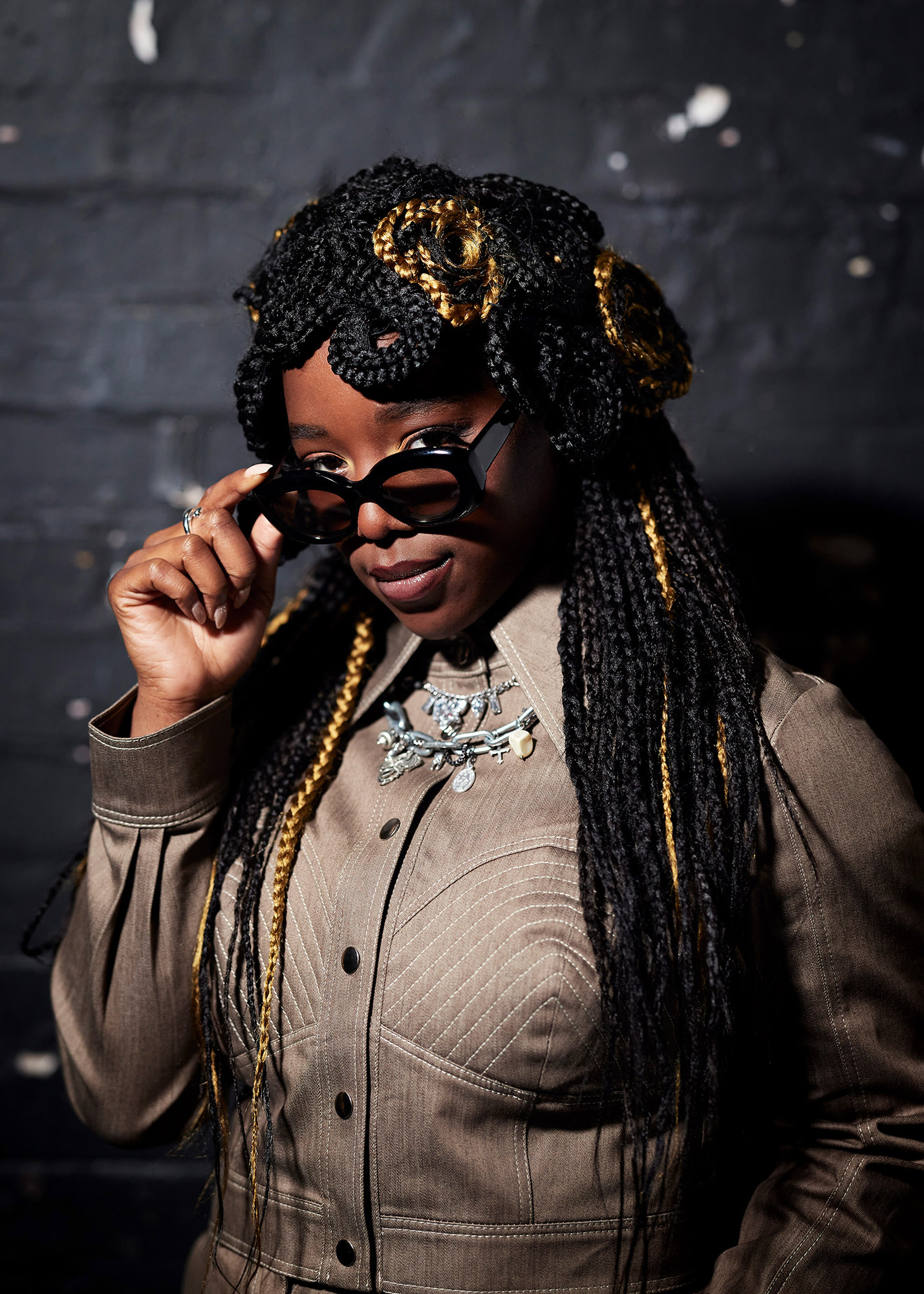 Corrina standing in front of the camera with her sunglasses on