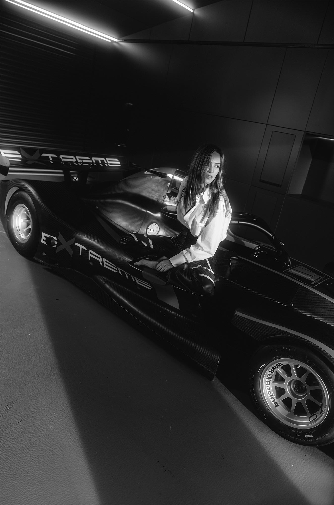 Carmen getting out of a racecar