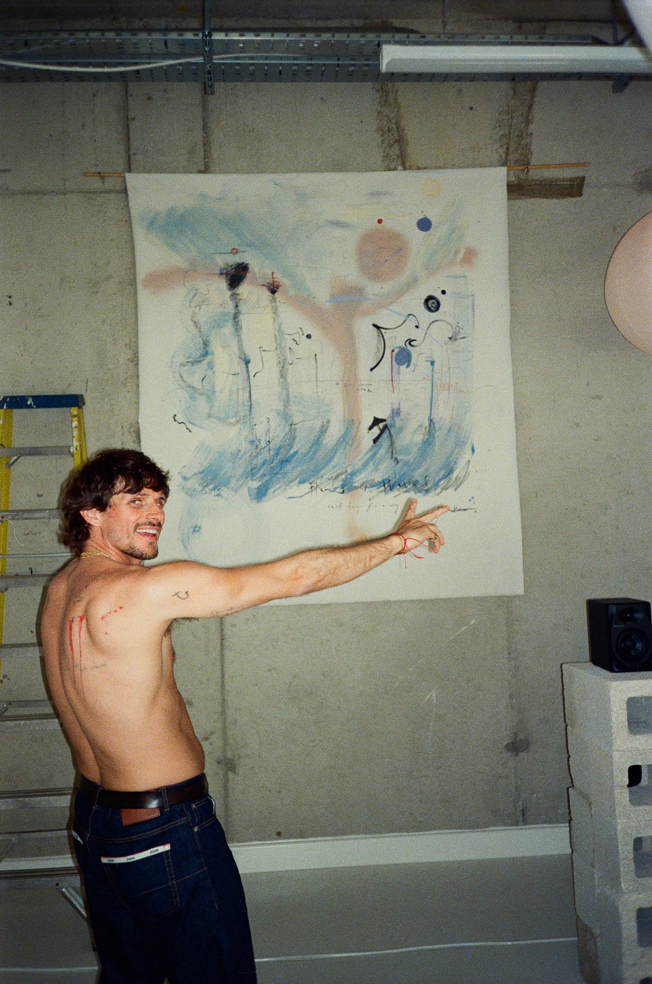 Jake standing in front of a painting