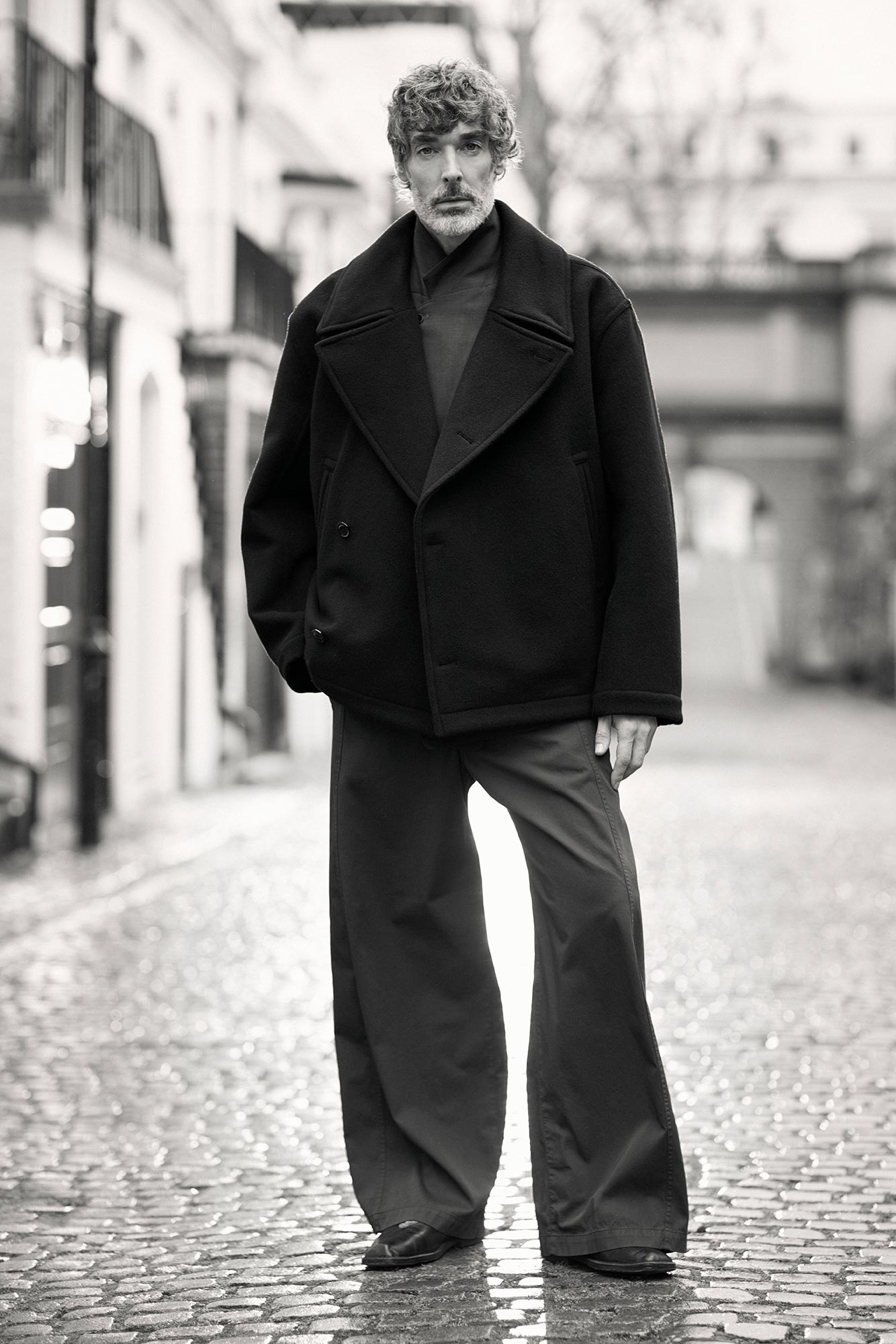 Richard wearing a large coat in front of the camera